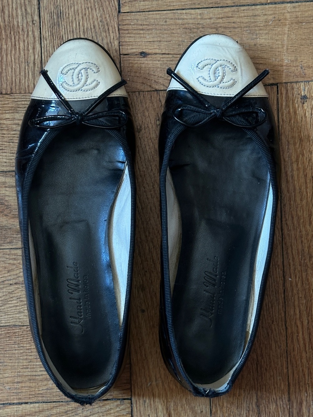 CHANEL Black Patent & Cream Cap-Toe Ballet Flats